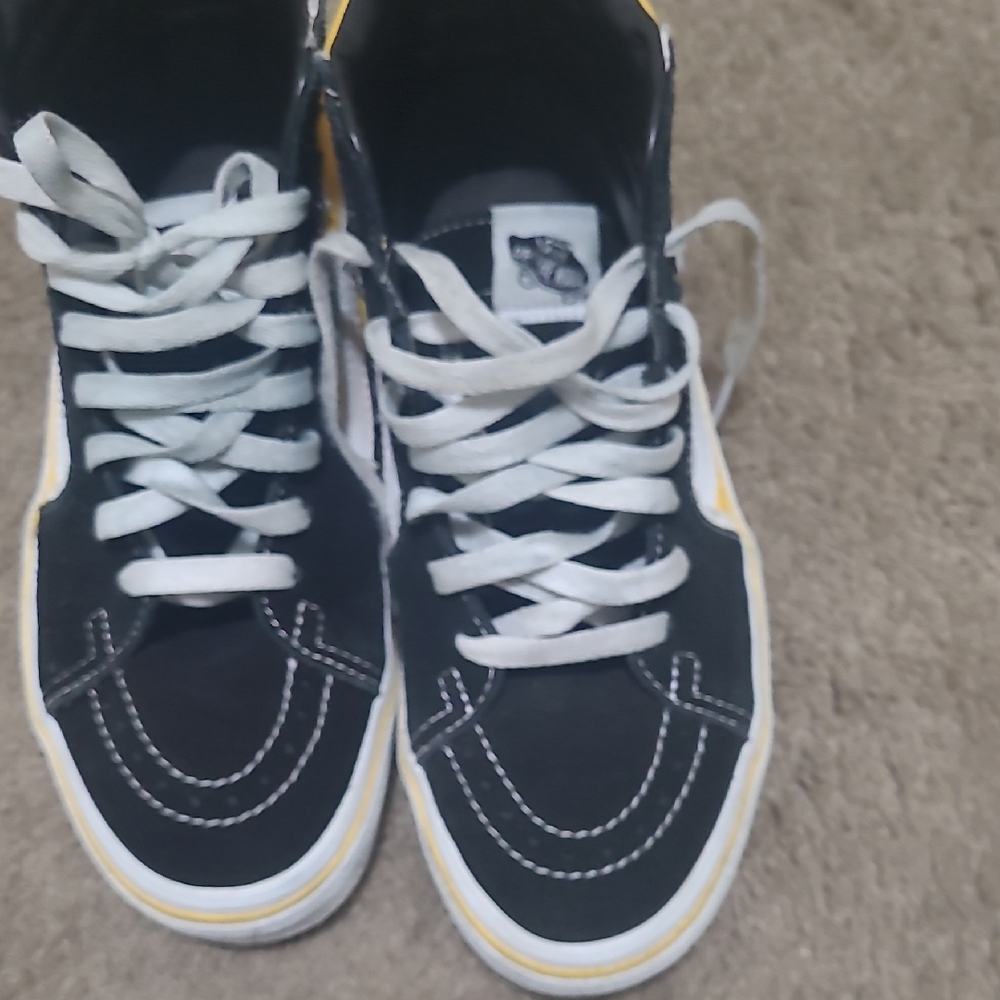 Vans Black and White High-Tops with Yellow Trim